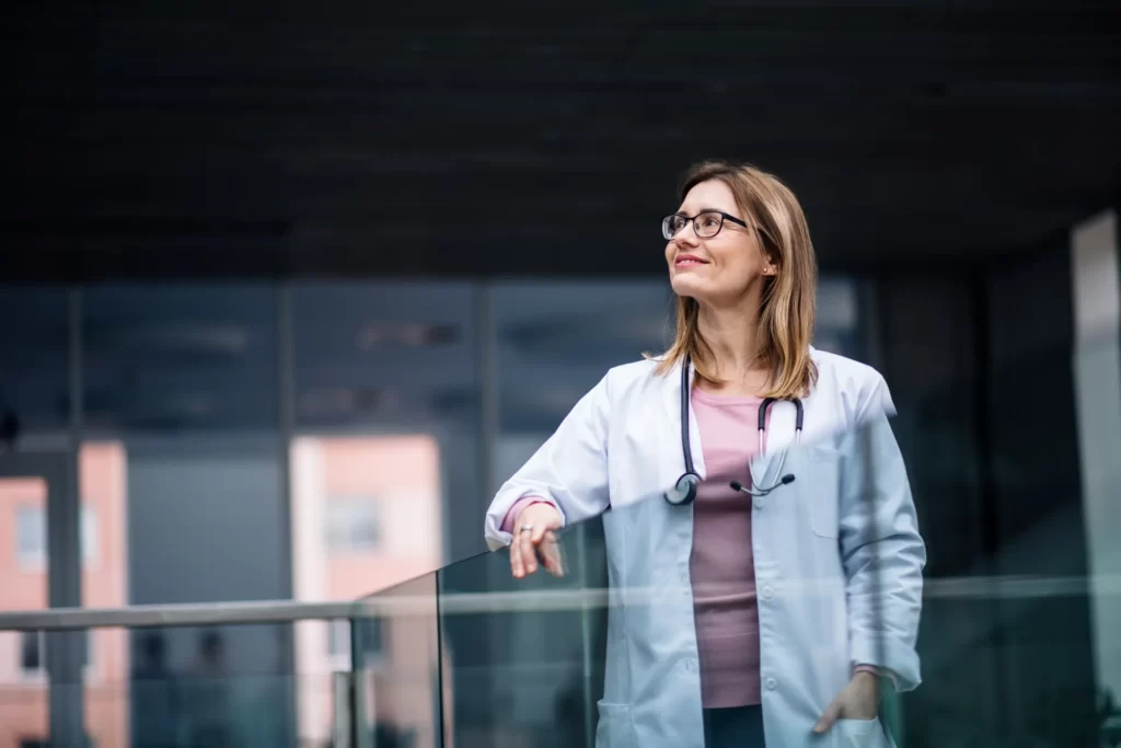 Licensed provider smiling in a clinical setting